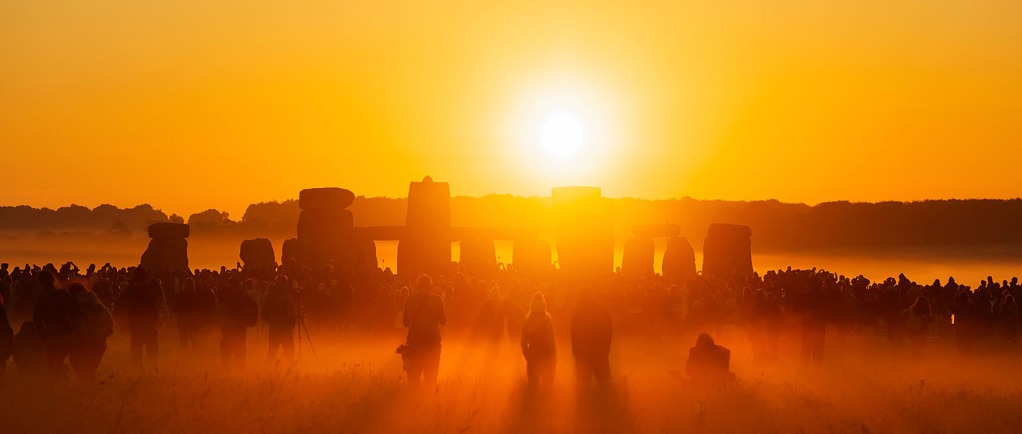 The sun rising over Stonehenge at summer solstice