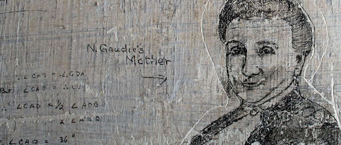 Detail of graffiti portrait of woman etched onto limewashed wall