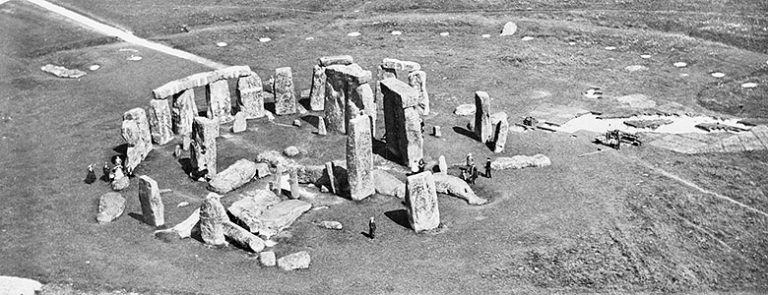 Aerial photograph of Stonehenge taken on 10 July 1924. The restoration work has ended, but Colonel Hawley’s excavations are continuing on the south-east side of the monument. 