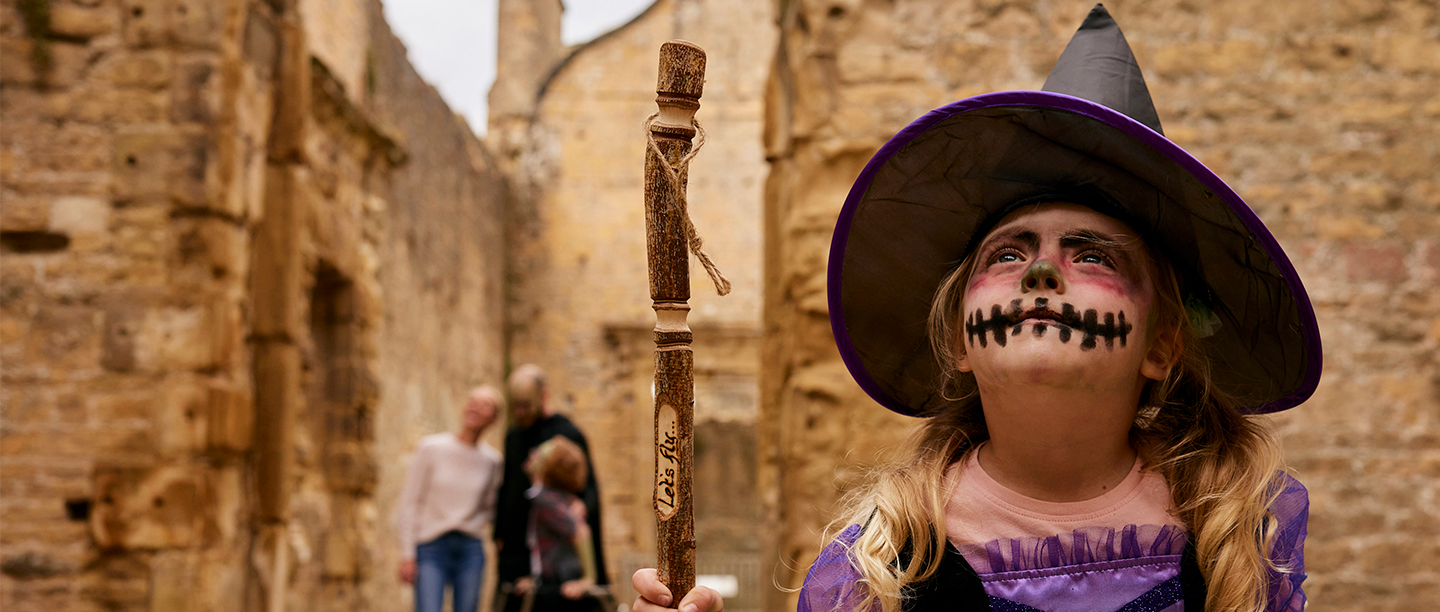 Image: little girl dressed as a witch at Bolsover Castle