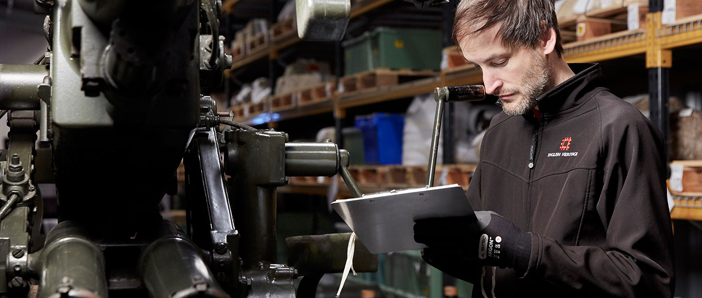 A curator assessing an object