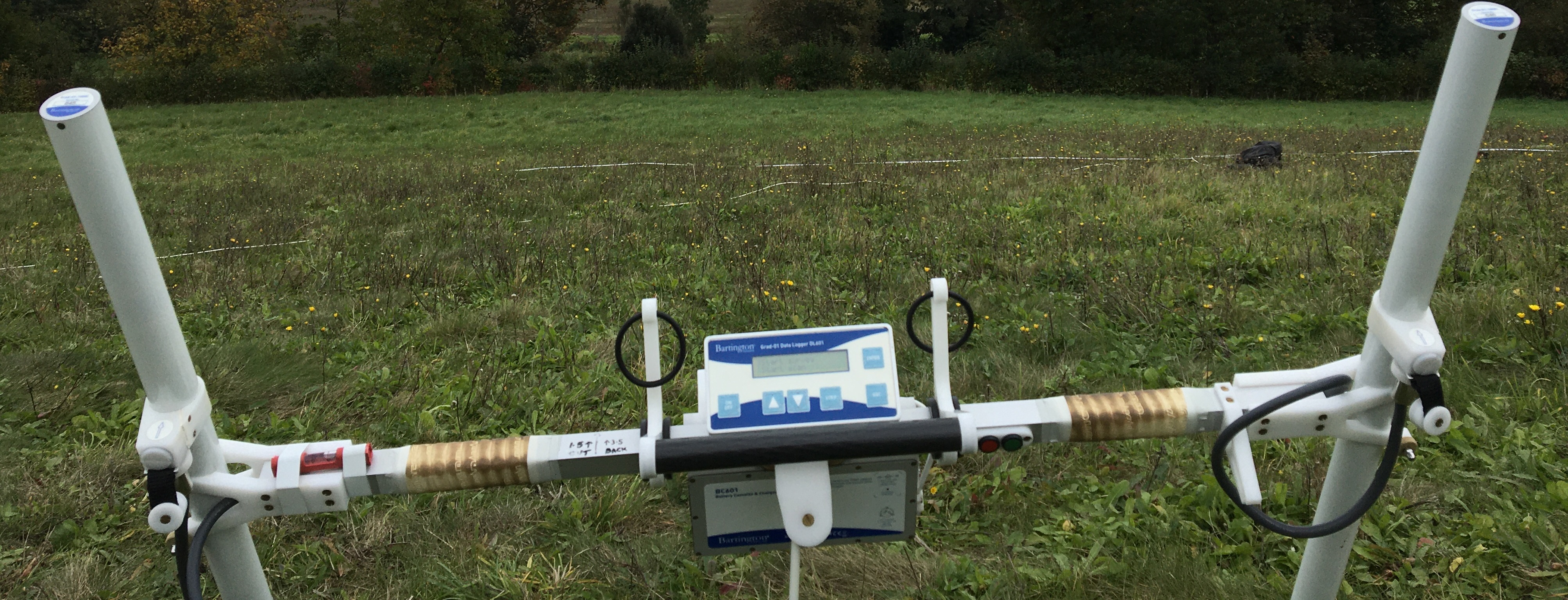 A white h-shaped frame with a digital screen in the centre. 