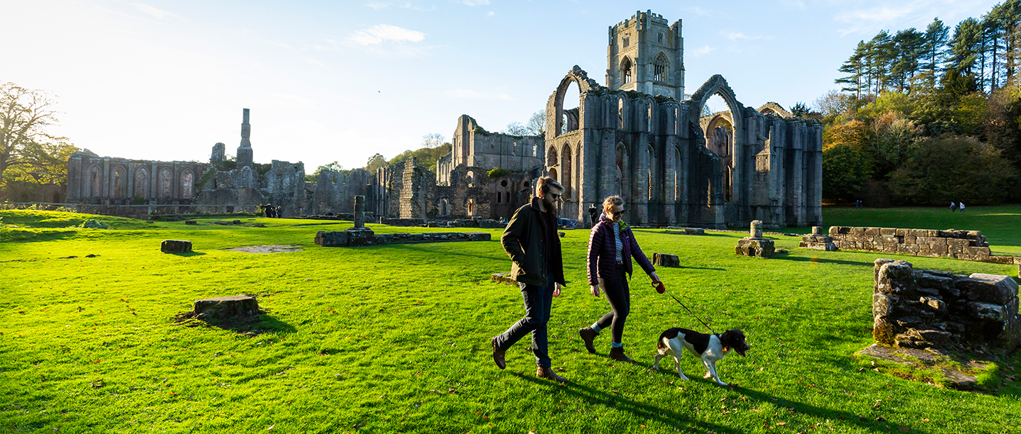 Image: visitors explore Fountains Abbey
