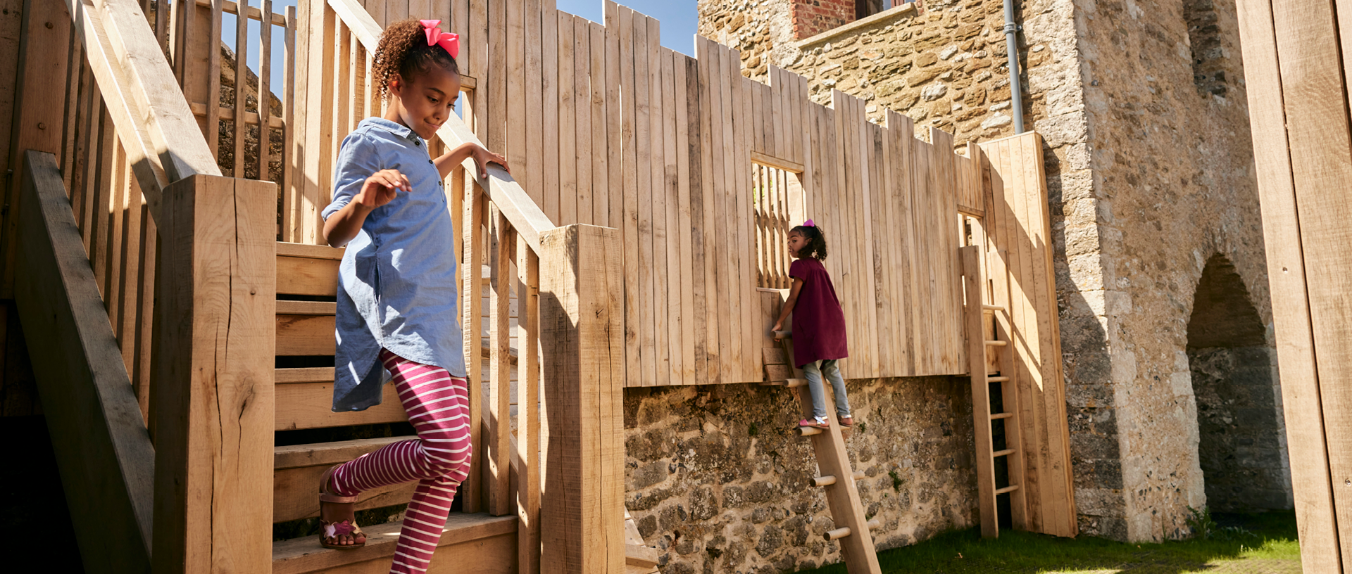 Children explore the castle themed play area at Dover Castle