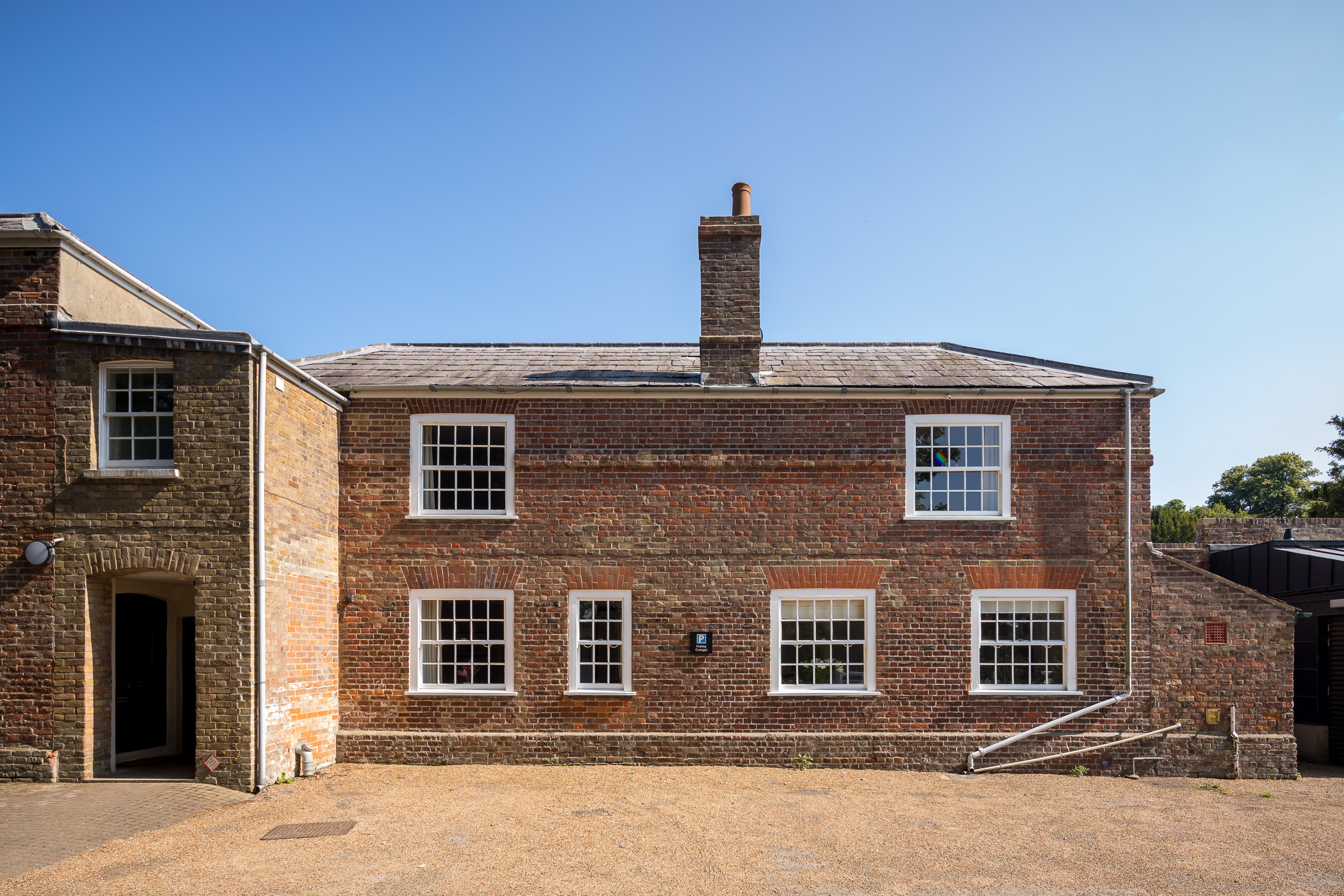 Front exterior and cottage parking