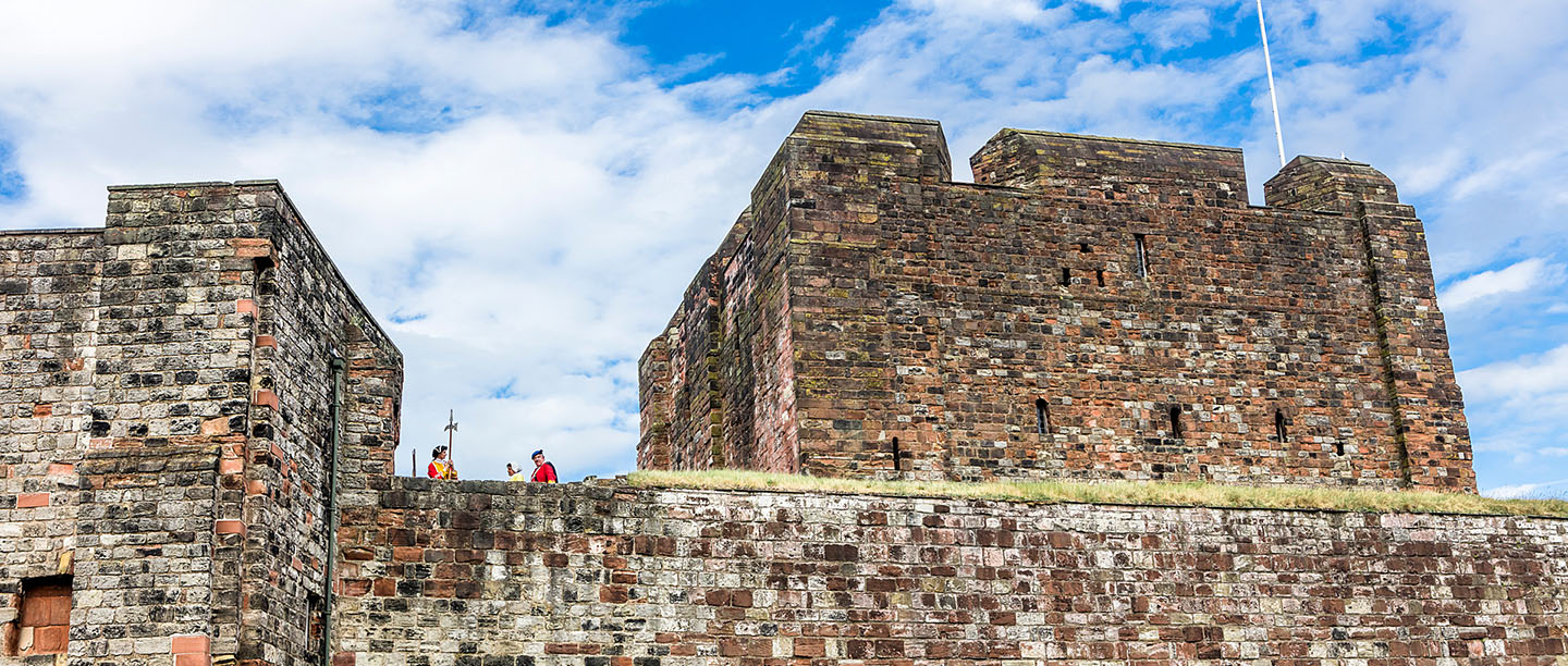 Visitors standing on the battlements of Carlisle Castle