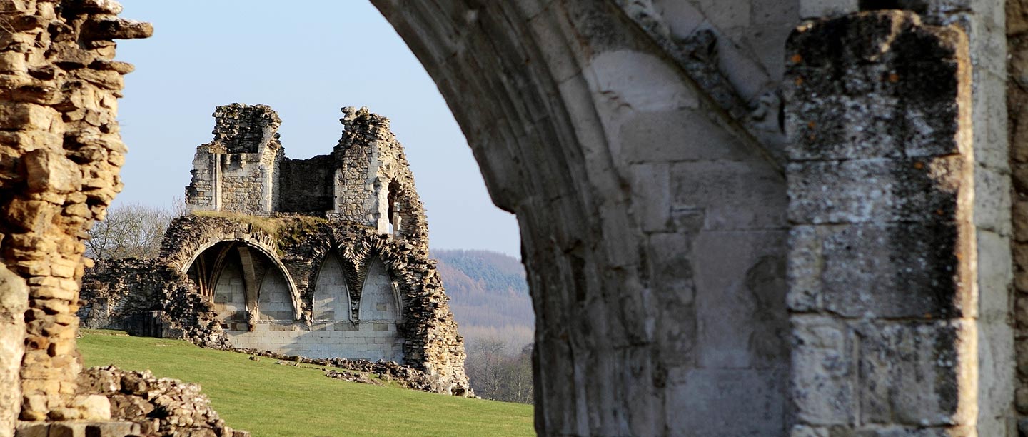 View through the gatehouse of Kirkham Priory to the vaulted remains of the cloister entrance