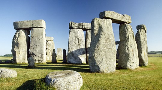 Stonehenge in the daytime against blue sky