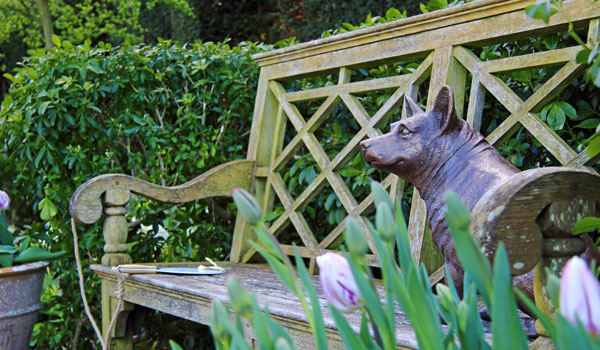 A statue of a royal corgi in the Queen Mother's Garden